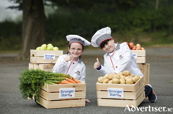 Twins Ben and Ava Wallace (age seven) from St Michael’s Primary School, Cootehill, Co Cavan helping Tesco Ireland announce plans to double the reach of its Stronger Starts programme to help children in 240 DEIS primary schools. Stronger Starts is an innovative community support programme from Tesco that helps to build thriving communities nationwide. By doubling the reach, Tesco aims to provide children in 240 DEIS primary schools who are most at risk of food insecurity with a food pack containing fresh apples, onions, potatoes, and carrots every week. 
Picture: Conor McCabe Photography.