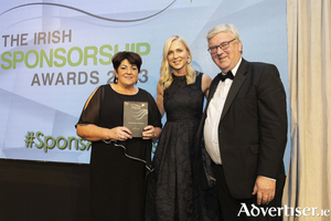Pat and Una McDonagh are presented with an award for Outstanding Contribution to Sponsorship at the Irish Sponsorship Awards last week by one of the award judges, Sarah McGovern.  Pic - Richie Stokes