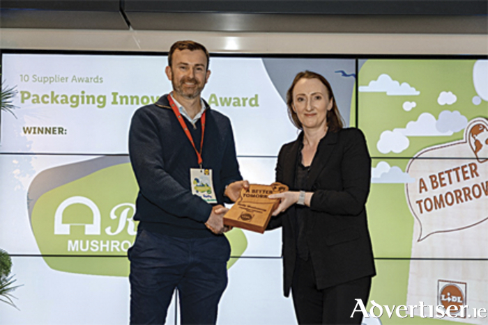Kevin Reilly from Reilly Mushrooms is pictured receiving the coveted award from Gillian Jenner, Senior Buyer at Lidl Ireland

