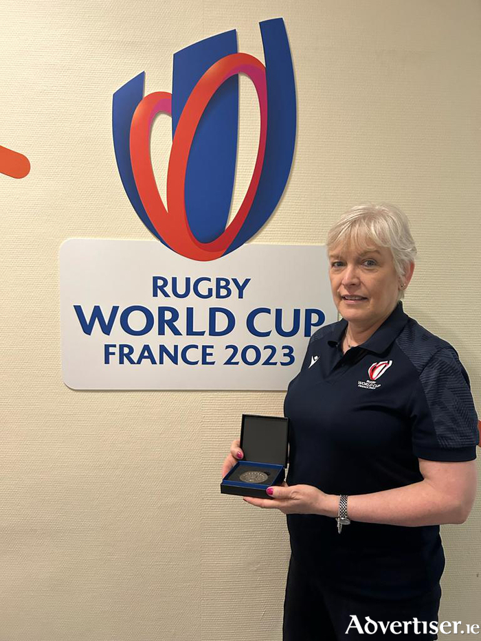 Joan Breslin presented with her RWC23 medal. All staff and players receive these medals, which this year were made from 200,000 recycled mobile phones.