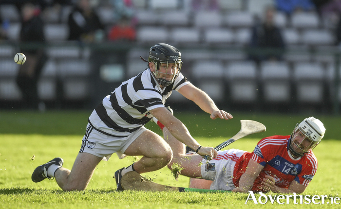 Fox in the box — Eanna Burke of St Thomas’ scores a goal despite the efforts of Dara Whelan of Turloughmore. Photo by Ray Ryan/Sportsfile
