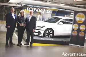 Pictured, l-r, Joe Rayfus, Chairman of the MMAI; Sarah Hayes of Hyundai Ireland; Tom Dennigan of awards sponsor, Continental Tyres; with the winning car, the Hyundai IONIQ 6.  PIC JULIEN BEHALPHOTOGRAPHY.
