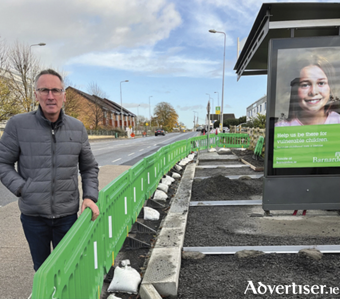 Cllr Aengus O’Rourke is pictured at the new bus shelter on MacDonagh Road
