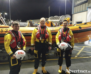 Galway RNLI volunteer crew Aaron O&rsquo;Reilly (left) and James Corballis (right) after completing and passing the last of their assessments afloat which means that they can become fully-fledged crew, with RNLI assessor trainer Sean Ginnelly (centre).