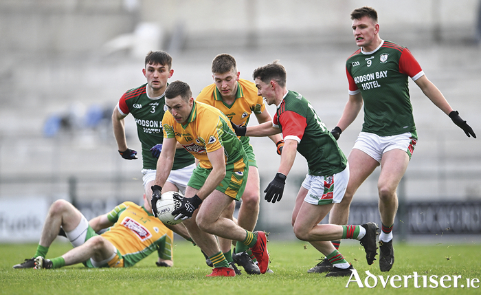 Dylan Wall of Corofin in action against Robbie Dolan of St Brigid's during the AIB Connacht GAA Football Senior Club Championship final between St Brigid's, Roscommon, and Corofin, Galway, at Dr Hyde Park in Roscommon. Photo by Piaras Piaras Ó Mídheach/Sportsfile