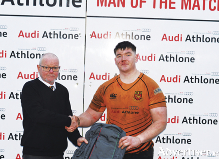Ryan O'Meara is presented with the AUDI 'Man of the Match' award by Buccaneer's president, Brendan Wilkins
