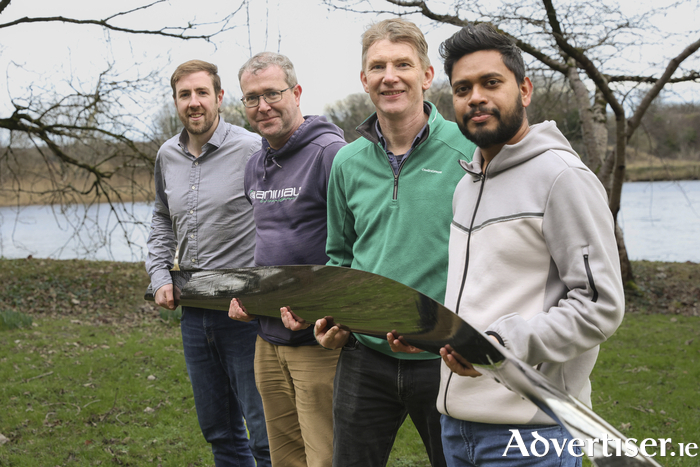 (L-R) Dr William Finnegan, Assistant Professor and Principal Investigator on the CRIMSON project; James McHale, Research Associate; Ciarán Kennedy, Research Fellow; Tenis Ranjan, postgraduate; all with Construct Innovate and Ryan Institute at University of Galway with the 5m carbon fibre reinforced polymer foil which forms part of the 80kW RivGen marine hydrokinetic energy turbine. 
Photo Martina Regan