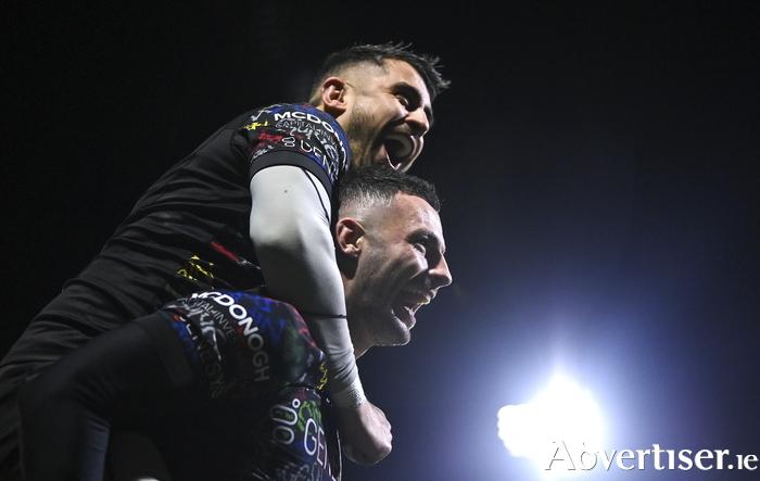 Andrew Smith of Connacht, bottom, celebrates with teammate Tiernan O'Halloran after scoring their side's fourth try during the Investec Champions Cup Pool 1 Round 4 match between Connacht and Bristol Bears at the Dexcom Stadium in Galway. Photo by Seb Daly/Sportsfile