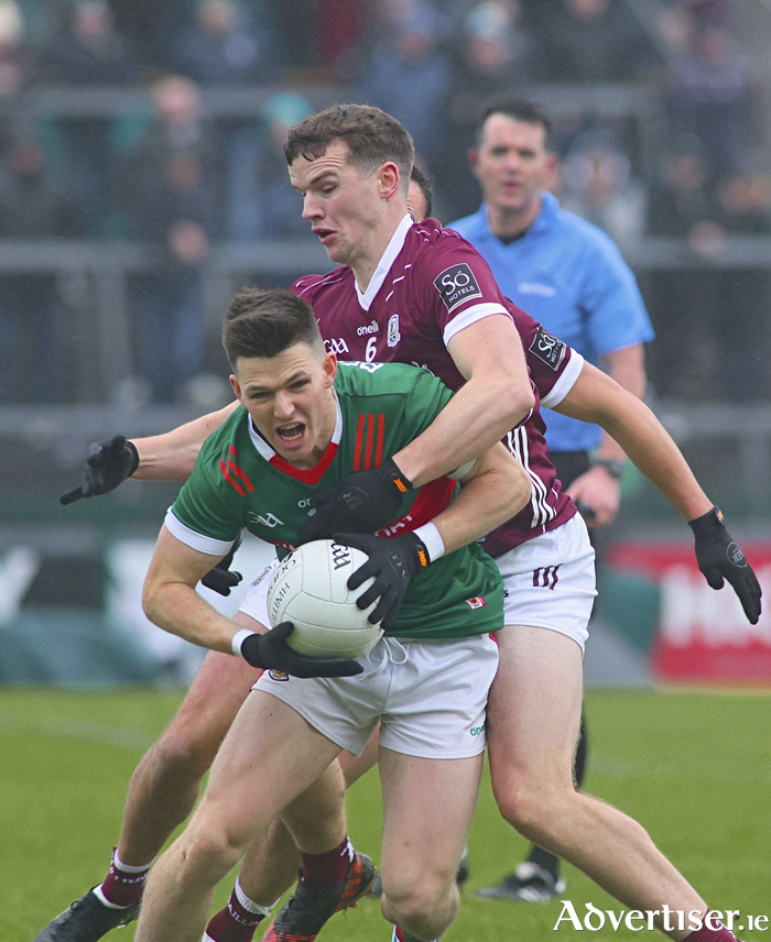 Galway captain John Daly and Mayo’s Fergal Boland in action from the Allianz National Football League Division 1 game at Pearse Stadium on Sunday. Photo: Mike Shaughnessy 