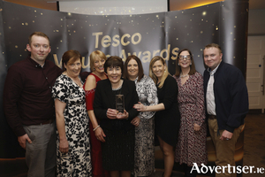 Pictured receiving the Tesco Business Impact Award the Tesco Indreabh&aacute;n team and Tesco Ireland Legal Director Sarah Gallagher.