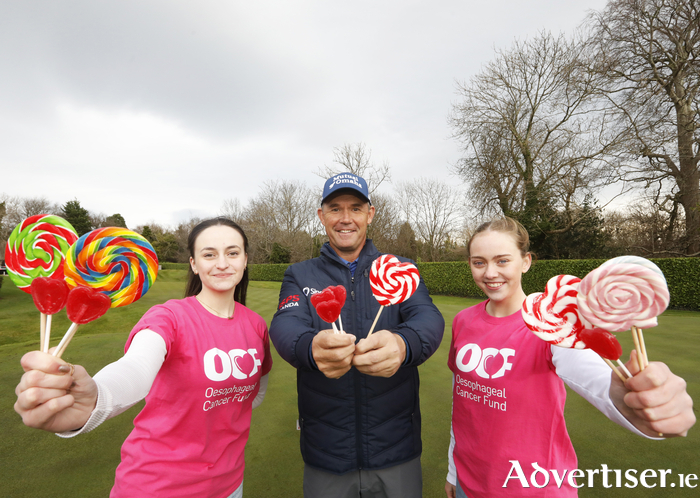 Golfer and OCF patron Padraig Harrington, with volunteers Emma O’Shaughnessy and Rose Martin.