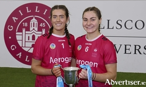 University of Galway co-captains Fiona Ryan and Tiffanie Fitzgerald with the Purcell Cup after they defeated SETU Carlow in the Electric Ireland Purcell Cup Final at the University of Galway Connacht GAA Air Dome on Sunday. Photo: Mike Shaughnessy 