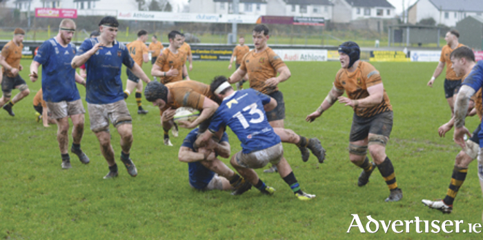 Cian McCann makes ground through the Queen’s University opposition prior to a home team try in Dubarry Park on Saturday afternoon