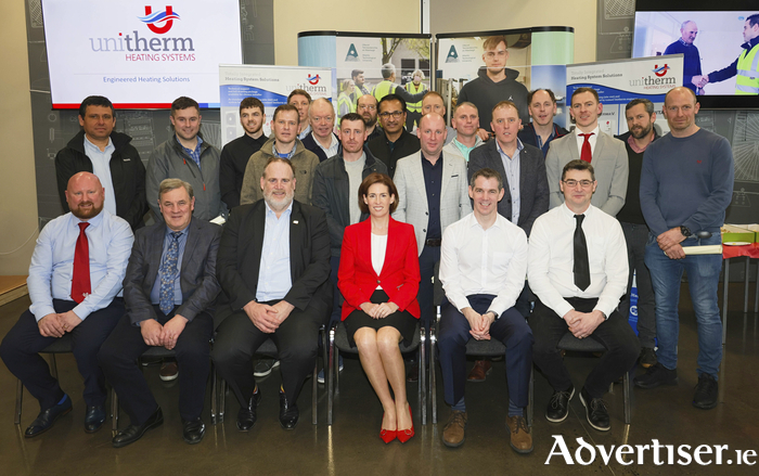 The first graduates of the ATU-Unitherm Heat Pump Certificate with ATU and Unitherm staff. Back row (l-r): Dr Laurentiu Dimache, ATU, Martin De Bhailis, Ryan Keane, Charles King Jr, David Hunt, Kieran Fitzpatrick, Shane McGough, Eamonn Peate, Sajumon George, Paul Brennan, Migel Coffey, Padraic Duignan, Laurence Walsh, Noel McGovern, Liam Jordan, Christoph Schellenberg, and Brian Ferguson. Front row: Shane Kelly, Unitherm, Peter Lynskey, Unitherm, Professor Graham Heaslip, Hildegarde Naughton, Brian McIntyre, and Dr Oliver Mulryan, ATU head of Dept of Mechanical and Industrial Engineering. Photo: Mike Shaughnessy.