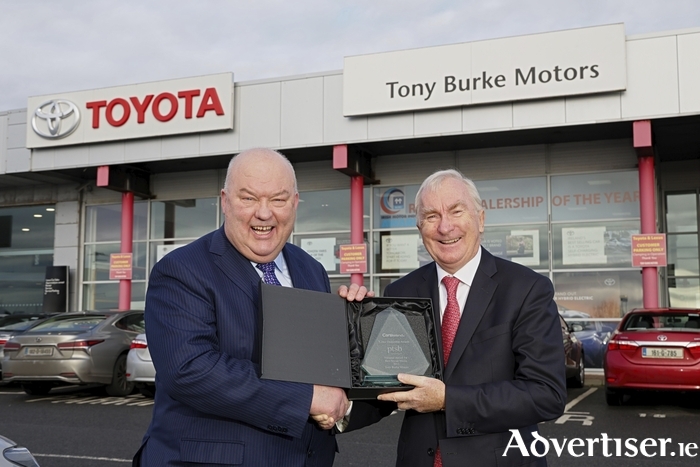 Gerard Halloran of PTSB presenting Tony Burke with their 2023 CarsIreland Dealership Award for Best Social  Media. 