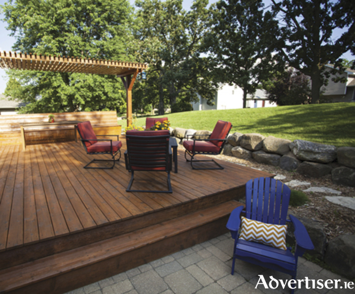 Outdoor stained wooden deck summer view.