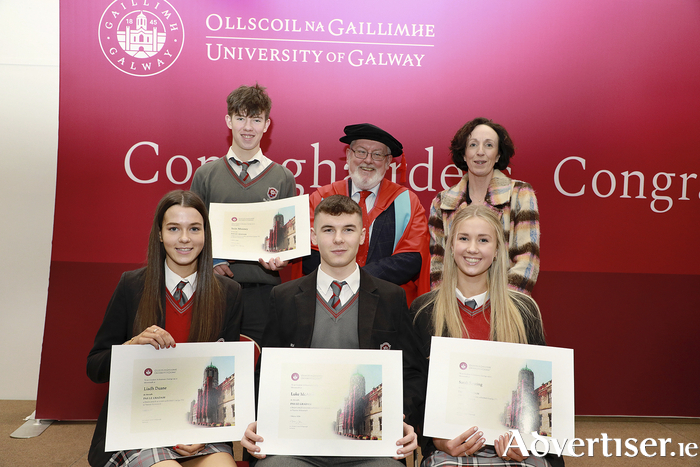 Seán Mooney, Liadh Duane, Luke McArdle and Sarah Keating from Coláiste Bhaile Chláir, Claregalway, Co Galway with Deputy Principal Emma Ryan and University of Galway Deputy President and Registrar Professor Pól Ó Dochartaigh.