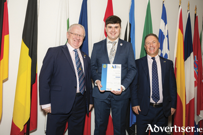 Athlone Community College student  Ryan Dolan receives his Rotary Youth Leadership Development award from Kenny Fisher, District Governor of Rotary Ireland and Patrick O’Riordan, Head of Public Affairs with the European Parliament in Ireland,  at an event at Europe House in Dublin recently. [Photo: Collette Creative Photography]
