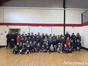 Garrycastle club player and Westmeath senior footballer James Dolan is pictured with participants in the Easter Camp recently hosted by the club