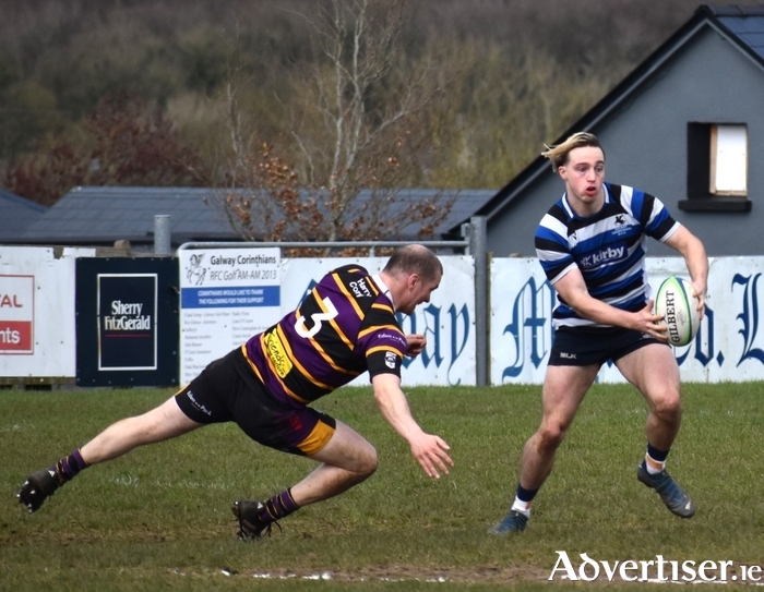Mícheal O'Reilly shows his speed to skip past the cover in Corinthians' win over Instonians. (Picture by Joanne Glynn Cullen)