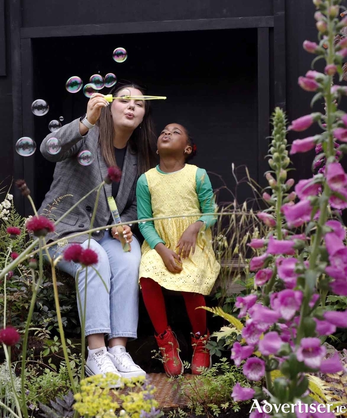  Pictured at the garden is Shauna Armstrong, Care Experienced Young Person, with five-year-old Eislish Funue. PHOTO: Mark Stedman