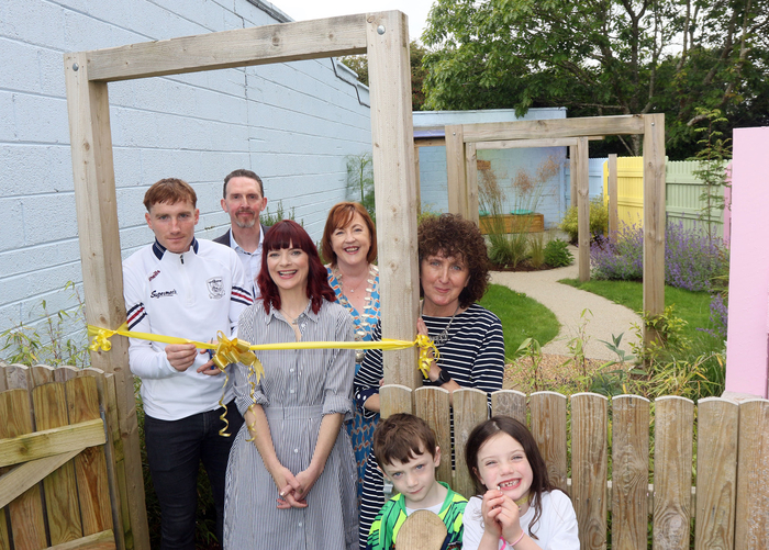 Galway Senior Hurling captain, Conor Whelan, cuts the tape to mark the opening of the new sensory garden at the Galway Autism Partnership house in Newcastle. Also in photo are Richard Taylor, chairperson, Galway Autism Partnership; Máire Bríd Ní Chonghaile, general manager, Galway Autism Partnership; Assumpta Gallagher, president, Network Galway; Mags McDonagh, trustee, Galway Autism Partnership; and Tomás and Islabelle Gallagher.