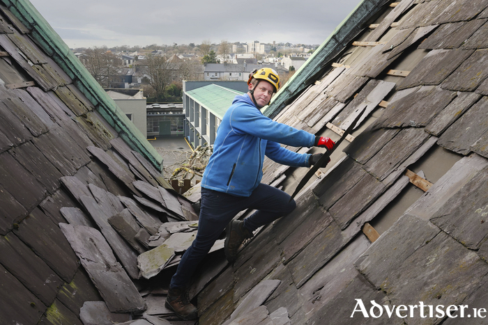 Niall McDonagh inspects damage done to St Nicholas Church by Storm Éowyn . Photo: Mike Shaughnessy 
Niall Mc Donagh working on the roof of St Nicholas' Church