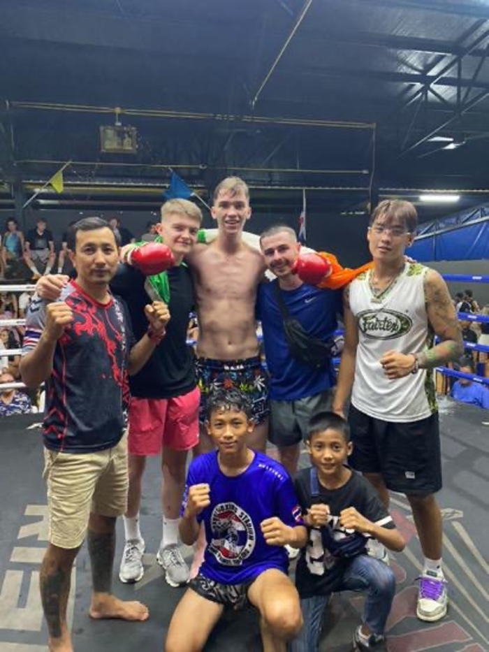  L-R: Darren Van Strien, Corey O Malley and Oisín Concannon after Corey’s victory with their Thai coaches.