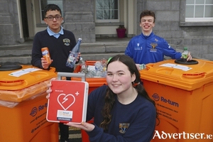 Dominic Bazan, Tess McNamara and Ed Graham, students of Col&aacute;iste &Eacute;inde, one of the first schools in Galway to take part in a Green Heart Safe initiative.Students are asked to collect plastic drink bottles and cans which can be exchanged for a life saving defibrillator. The program is in partnership with SmartMedical and Galway City Council. Photo: Mike Shaughnessy