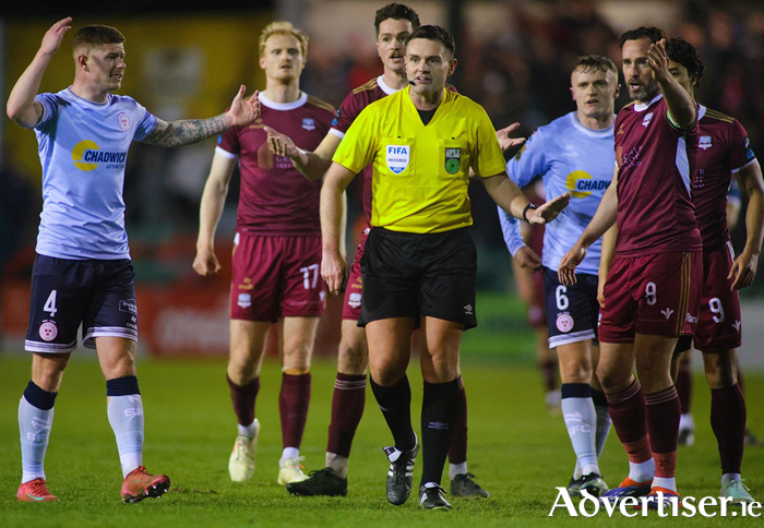 Galway United captain Gregory Cunningham and Sheloburne’s Kameron Ledwidge plead with referee Rob Hennessy regarding United’s goal in action from the SSE Airtricity Men’s Premier Division game at Eamonn Deacy Park last Monday night. Photo: Mike Shaughnessy