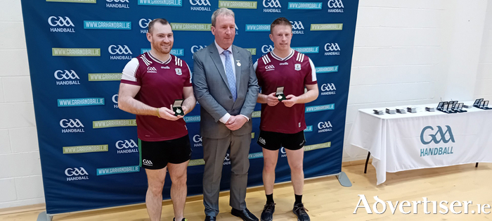 Conor Noone and Seamus Conneely pictured with GAA Handball President Conor McDonnell.