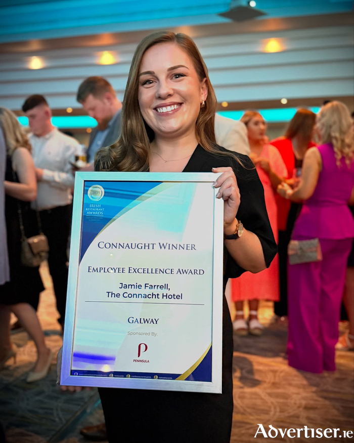 Jamie Farrell pictured with her Employee Excellence Award.