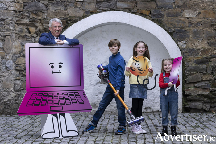 Galway householders are being urged to bring their batteries, electrical, and electronic waste to a set of free collection days, hosted by WEEE Ireland and supported by Galway County Council. Pictured are WEEE Ireland CEO Leo Donovan, Ethan Holmes (10), Sienna Lavery (10), and Freya Lavery (six). Photo: Shane O'Neill, Coalesce.