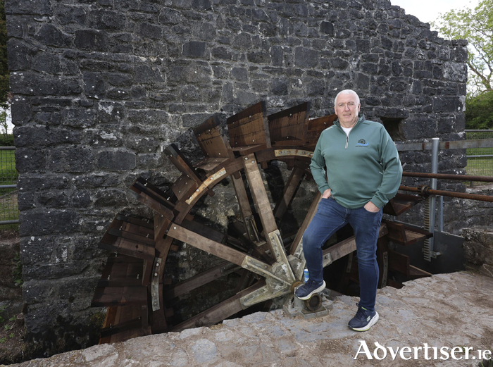 Eugene Murphy at the restored Mill Wheel beside Thoor Ballylee. Photo: Mike Shaughnessy