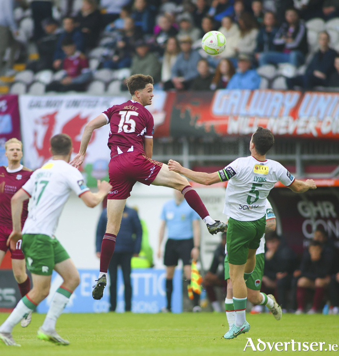 Galway United’s Patrick Hickey outjumps Cork City’s Darragh Crowley and Charlie Lyons in action from the SSE Men's 
Premier Division game at Eamonn Deacy Park last Friday night. Photo: Mike Shaughnessy