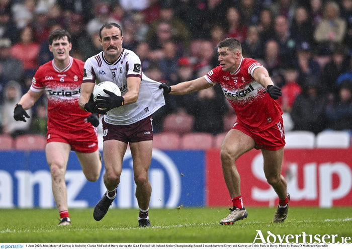 John Maher of Galway is fouled by Ciarán McFaul of Derry during the GAA Football 
All-Ireland Senior Championship Round 2 match between Derry and Galway at Celtic Park in Derry. Photo by Piaras Ó Mídheach/Sportsfile