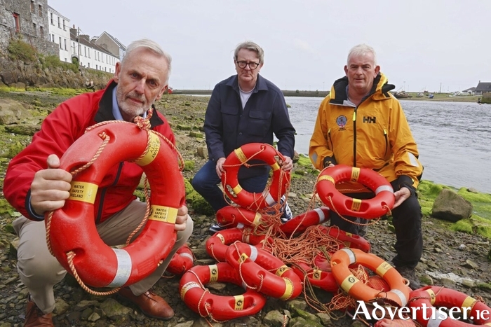 Roger Sweeney, Deputy CEO, Water Safety Ireland ( left), Deputy Mayor of Galway Councillor Neil McNelis and Mike Swan of the Galway Lifeboat RNLI at the Spanish Arch with the haul of recovered ring buoys. Photo: Mike Shaughnessy