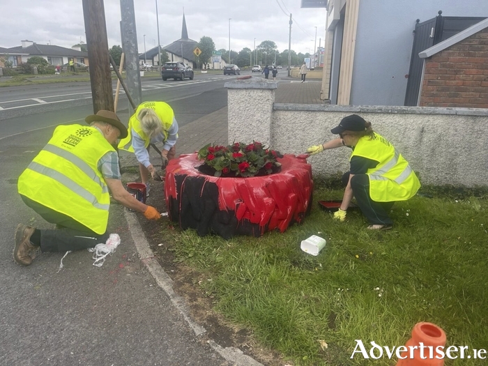 Volunteers decorating planters in Claregalway.