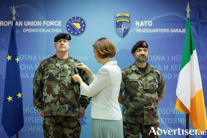 Sgt Maj Conor Kelleher (L) and Lt Col Karl Connolly (R) presented with medals for Operation Althea by Hildegarde Naughton