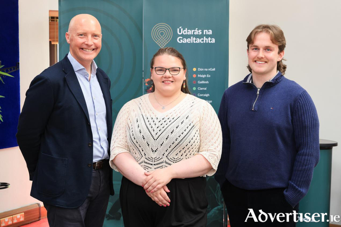 Tomás Ó Síocháin, CEO of Údarás na Gaeltachta, with 2024 bursary recipients and MA in Planning and Development students Aoife Nee and Eoin Brett. Credit: Martina Regan.