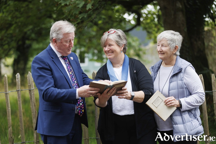 Minister of State with Responsibility for International and Road Transport, Logistics, Rail and Ports, Seán Canney accepting on behalf of the State a copy of one of WB Yeats Books from Cicely Muldoon, Superintendent Yosemite National Park USA and her SIster Kate Muldoon at a NPWS Heritage Event at Coole Park Nature Reserve, Co Galway on Friday. The Book belonged to their Great Grandfather and they donated it to the state. Photograph by Eamon Ward