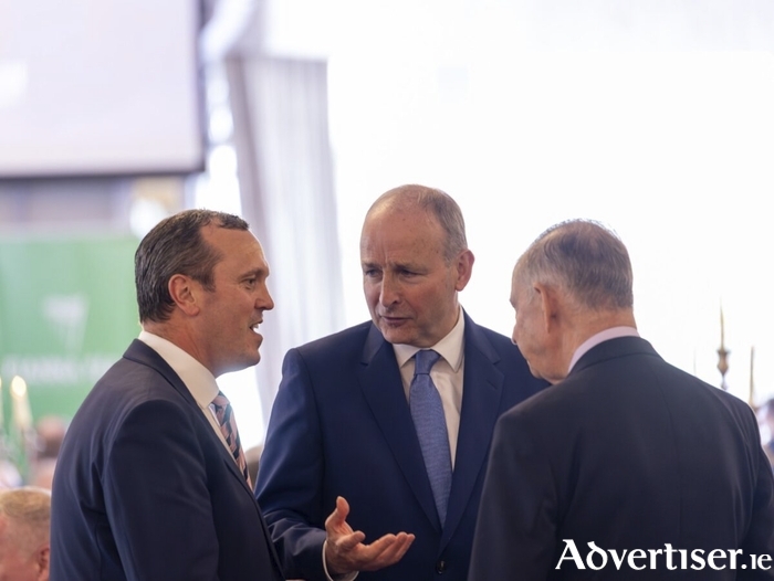L-R: John Connolly TD in conversation with Taoiseach Micheál Martin and Éamon Ó Cuív