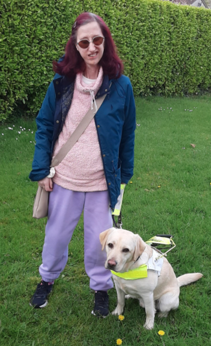 Gina McNamara, pictured here with her guide dog, Joe. 