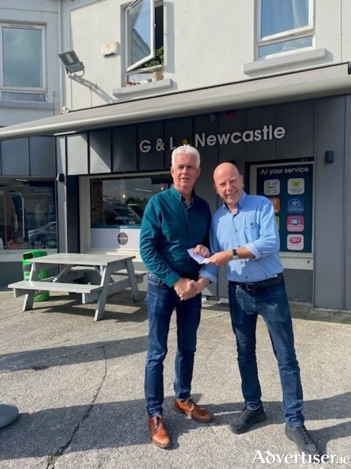 Ken Kineen, on behalf of Salthill FC /Salthill Devon Legends, presenting donation to Fintan Maher of Galway Simon Community, proceeds from their annual charity match at Drom on July 18.