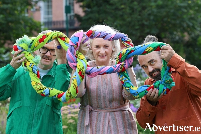 The ties that tie and the links that link: Emmett Scanlon, Director, Irish Architecture Foundation, Mary Blanchfield, CEO of Design & Crafts Council Ireland (DCCI), and Tom Watts, DCCI Head of Design, pictured holding a chain of claddagh scarves, designed by Irish designer Megan Nolan Walsh, to mark this year's invitation for participation in DCCI Irish Design Week 2025, which takes place on 17-21 November this year in the Royal Irish Academy of Music. This year's theme, 'The ties that tie, and the links that link', is inspired by William (Bill) H. Walsh, founder of the Kilkenny Design Workshops, and invites designers to reflect on how their work connects us across ideas, disciplines, generations, and geographies. Photo Leon Farrell