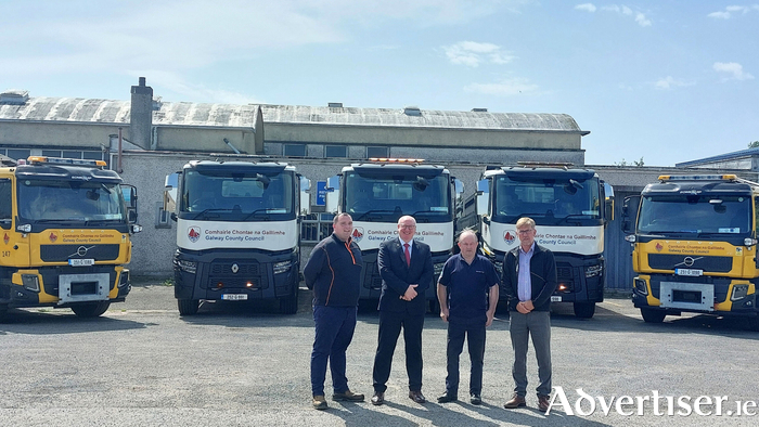 Declan Thornton, Driver; Liam Conneally, Chief Executive; Noel Divilly, Machinery Yard Supervisor; and Uinsinn Finn, Director of Services, Galway County Council pictured with the five new trucks. Credit Galway County Council.