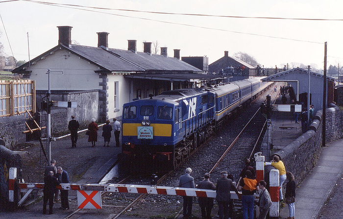 Pictured here is "The Western Enterprise" railtour event, which took place at the closed Tuam Railway Station on April 7, 1990. Photo attribution: 07.04.90 Tuam 111” by Phil Richards, CC BY-SA 4.0 on Flickr.