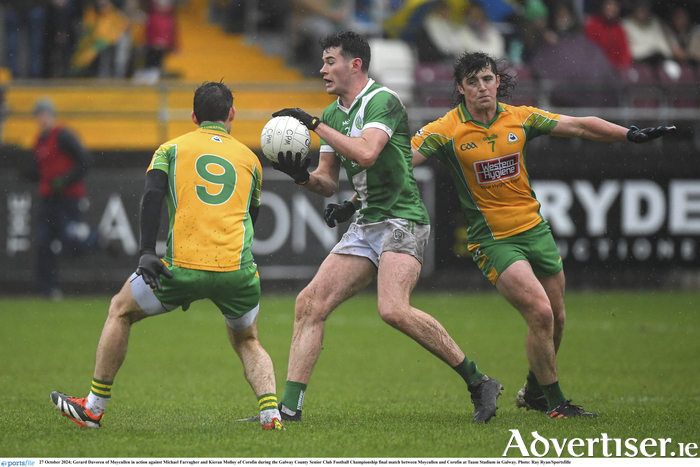 Gerard Davoren of Moycullen in action against Michael Farragher and Kieran Molloy of Corofin during the Galway County Senior Club Football Championship final match between Moycullen and Corofin at Tuam Stadium in Galway. (Photo by Ray Ryan/Sportsfile)