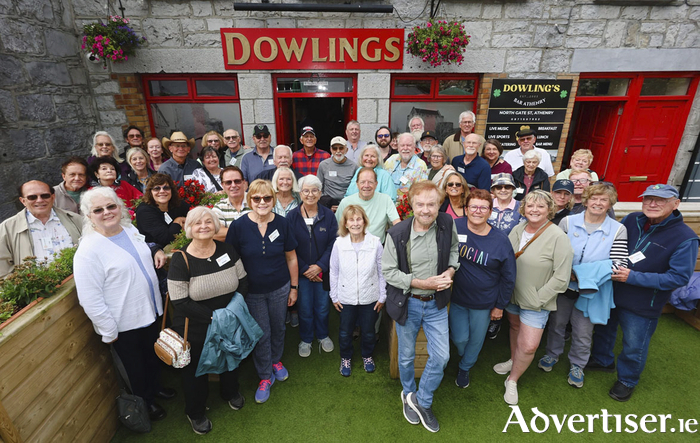 Irish singer Cathal Dunne with a group of American tourists outside Dowlings Pub, Athenry where they enjoyed a Welcome To Ireland drink on Tuesday before traveling the Wild Atlantic Way. Photo: Mike Shaughnessy