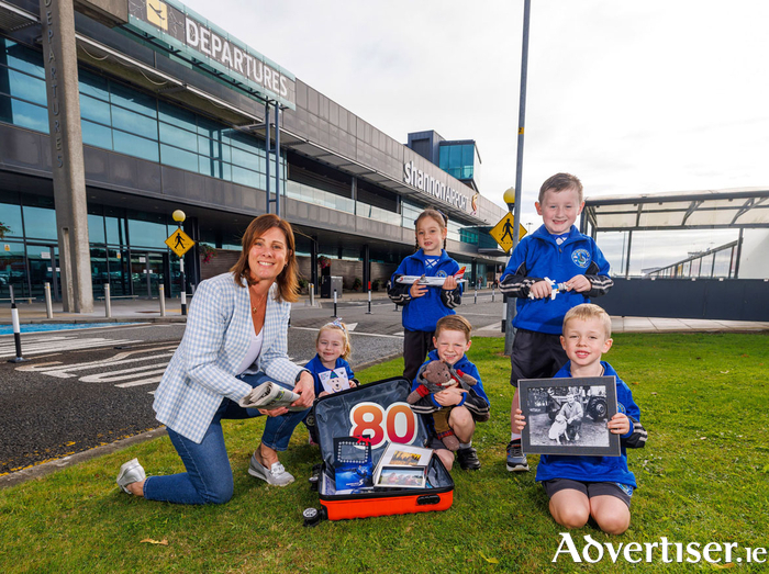 Repro Free: Pamela Brooks, Head of Operations at The Shannon Airport Group with senior infants pupils from Shannon Airport 1 NS (St. Senans) - Riea Carroll, Freddie Lake, Jack McMahon (front), Molly O'Mara and Jake Fleming (back). Photo by Arthur Ellis.